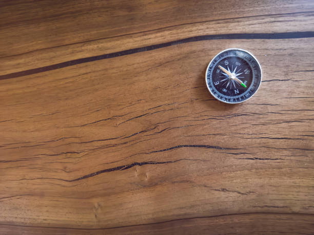 compass on wooden deck background