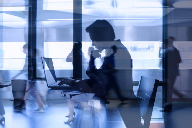 istock Multiple exposure of business man concentrating at office computer work 1486906377