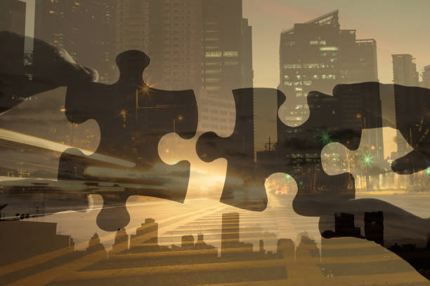 hand linking puzzle piece together business idea strategy