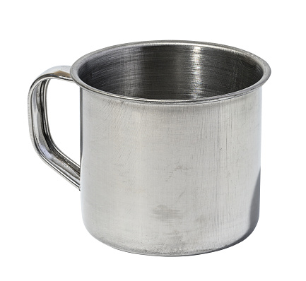 Empty metal mug with handle on white isolated background