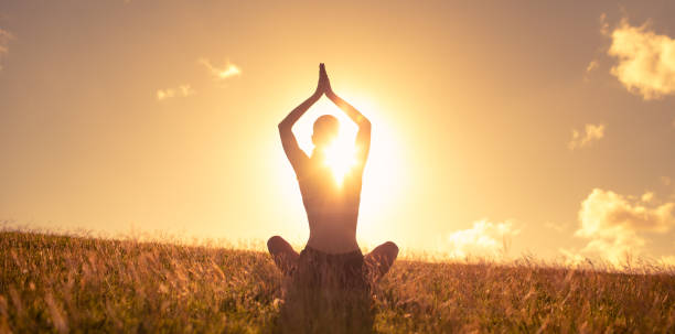 istock Woman practicing calm peaceful meditation outdoors 1486907242