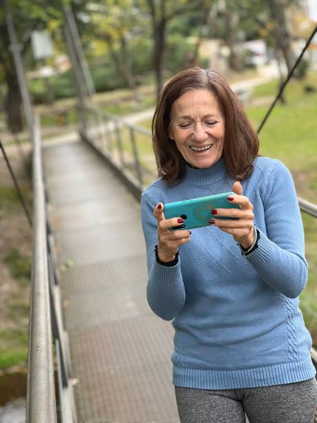 istock Senior woman with mobile phone 1486907362