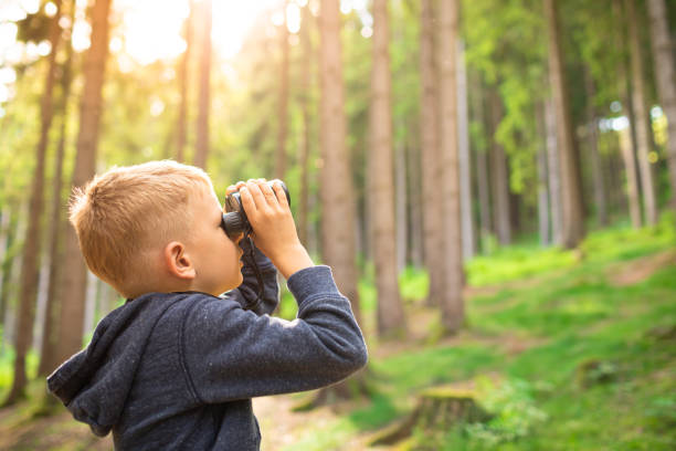 istock child in the forest looking at wildlife nature discovery 1486907382