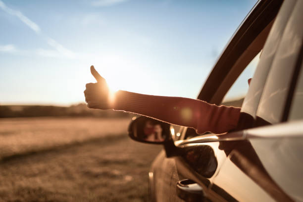 istock Person enjoying summer fun road trip 1486908800