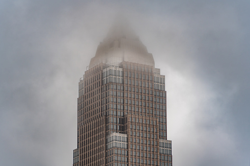 Outdoor View Of Key Tower Cleveland Ohio Skyline Architecture Building With Dramatic Foggy and Cloudy Sky in Downtown City
