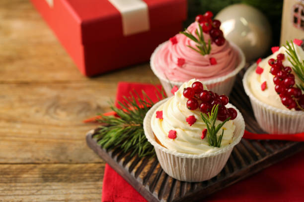 istock Delicious cupcakes and Christmas decorations on wooden table, space for text 1486909855