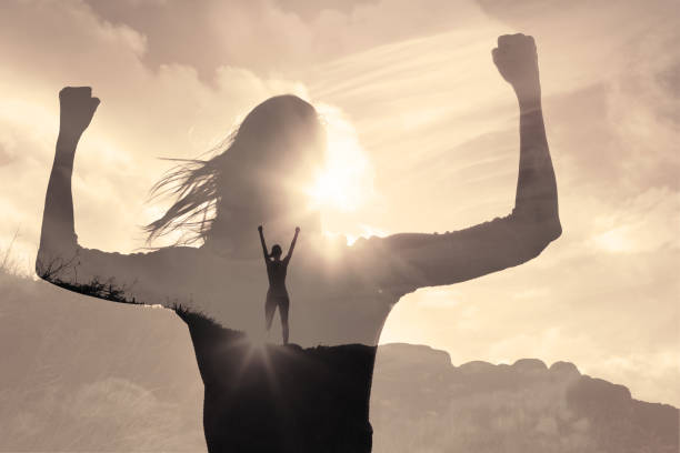 istock Woman power! Victory on a mountain top. 1486910311