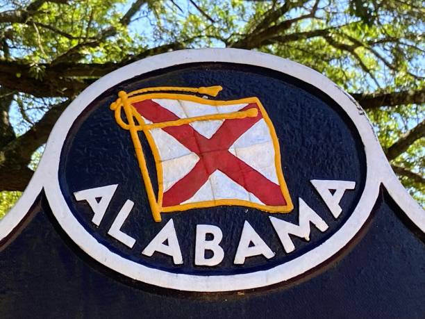 Alabama State Flag Alabama State Flag in Montgomery, Alabama alabama us state stock pictures, royalty-free photos & images