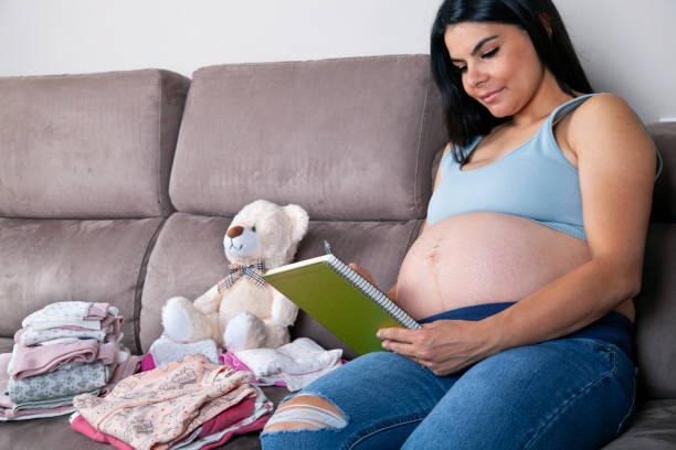istock Let me write down what I have for the baby! 1486912588
