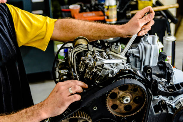 istock A Car Maintenance Man is Checking the Car Engine in Auto Service. 1486917197