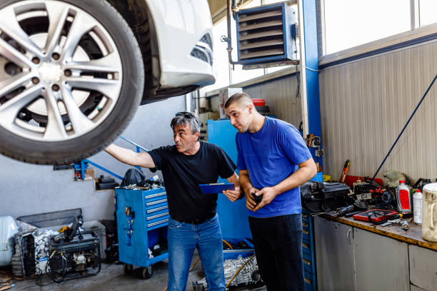 istock A Man Drove a Car to the Service Workshop and is Analyzing Problems with Car Mechanic. 1486917423