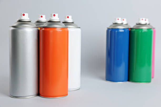 istock Colorful cans of spray paints on light grey background 1486926785
