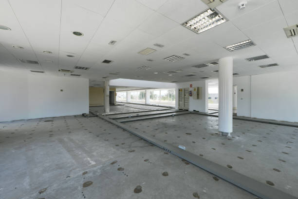 istock Offices of an industrial warehouse with technical ceilings and floors with gutters without paving 1486927986