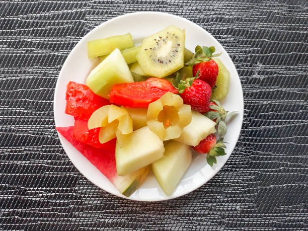 istock Fruit slices including watermelon, melon, kiwi, strawberry, pineapple, nutmeg 1486937073