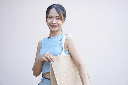 world plastic free day Women use cloth bags instead of plastic bags for shopping.
