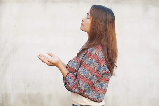 Asian woman praying to god