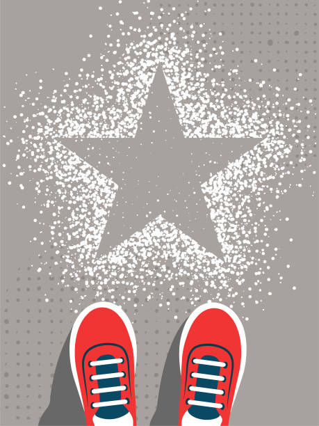 istock Feet in sneakers stand in front of the star sign 1486942325