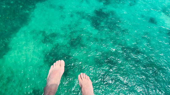 aerial view of the ocean with a jet ski and a boat represents the joy of adventure and exploration. The vastness of the sea and the freedom of riding the waves