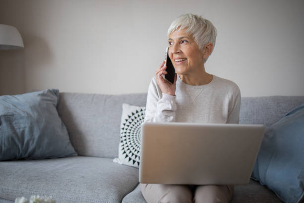 istock Senior woman working from home 1486943940