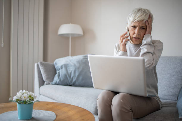 istock Senior woman working from home 1486943951