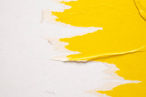 istock Old grunge ripped torn yellow paper poster surface texture background 1486944443