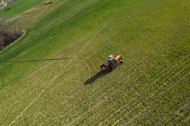 istock farmer driviing uphill crawled tractor in the farm 1486944500