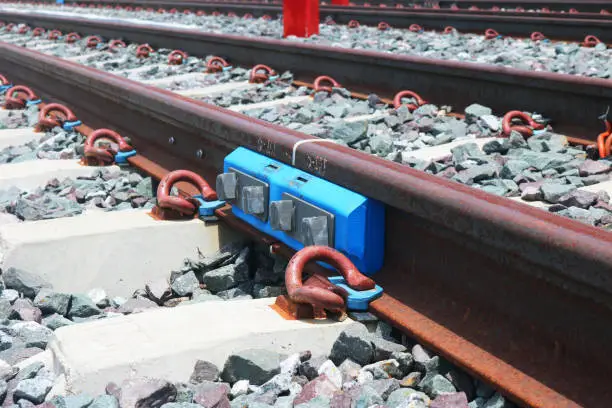 Fishplate steel rail connection on concrete sleepers.