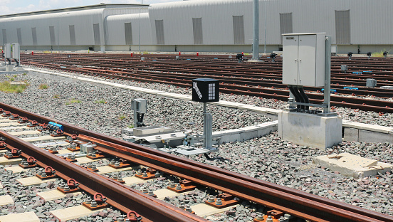 Steel railway with signalling light turnout system.