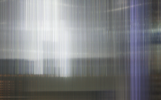 Polycarbonate translucent pattern texture background in dark light.