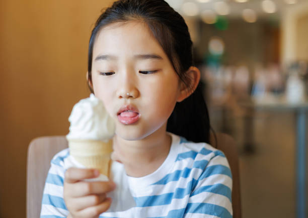 istock Little Girl Eating Ice Cream 1486950489