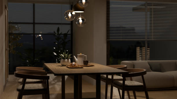 design intérieur d’une maison de luxe moderne salon avec table à manger la nuit - soft lighting photos et images de collection