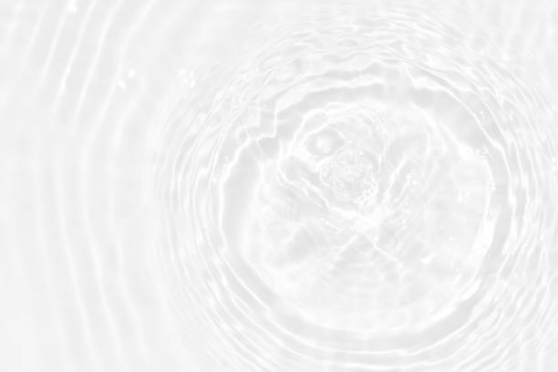 istock White water with ripples on the surface. Defocus blurred transparent white colored clear calm water surface texture with splashes and bubbles. Water waves with shining pattern texture background. 1486956397