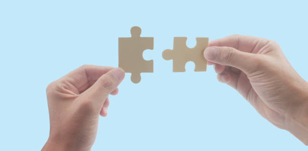 istock Connecting jigsaw puzzle. Business solutions success 1486958820