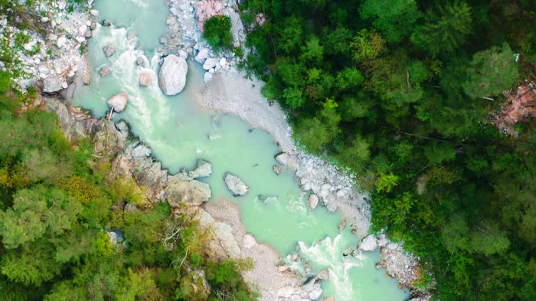 Piave river with clear turquoise water and white sandy bank