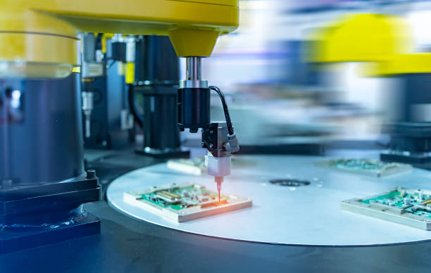 istock Robot holding glue syringe Injection with robotic machine vision system 1486964781