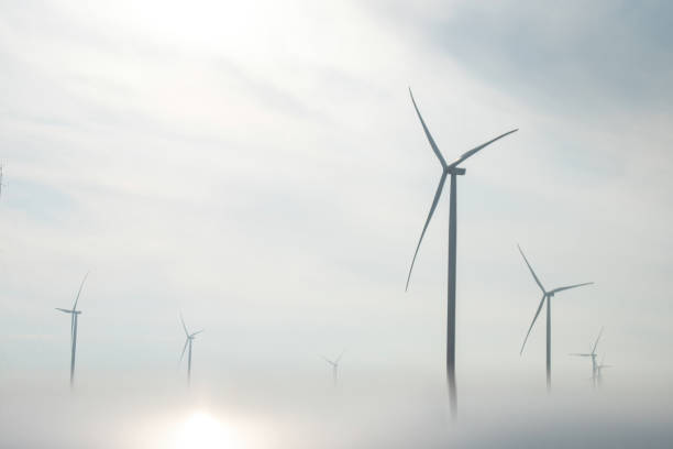 istock Windmills farm for producing energy hidden in thick smog 1486966111