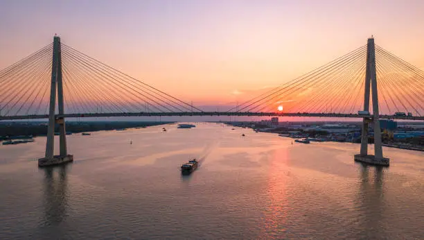 Photo of Aerial view of My Thuan cable-stayed bridge in the sunset, Tien Giang province