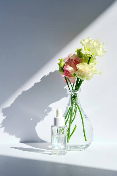 istock Serum with a dropper with spring flowers. 1486968062