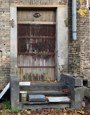 Old wooden door in a brick  wall