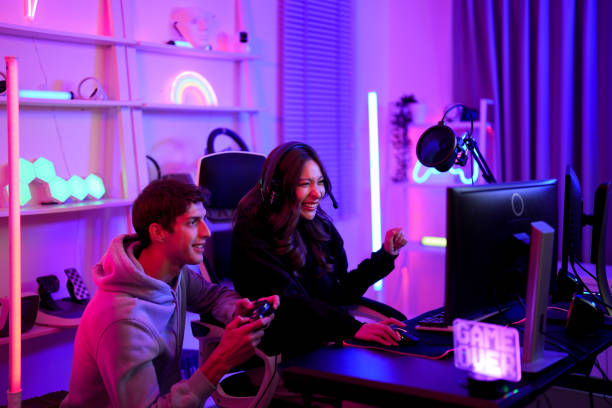 istock Couple e-sport gamer playing and helping clear stage challenge with happy enjoy feeling together in entertainment room 1486972243