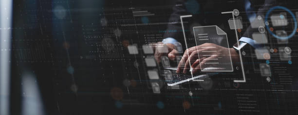 istock Document Management System (DMS) being setup by IT consultant working on laptop computer in office. Software for archiving, searching and managing corporate files and information 1486978388