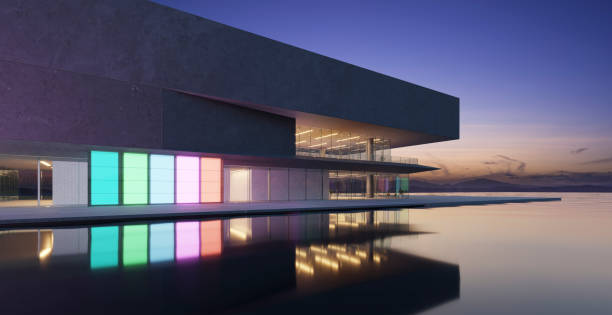 istock 3D modern buildings have colored gradient glass walls with a pond landscaping in front 1486983294