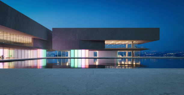 istock 3D modern buildings have colored gradient glass walls with a pond landscaping in front 1486983409