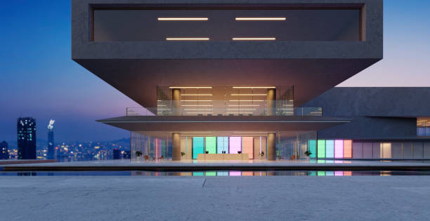 istock 3D modern buildings have colored gradient glass walls with a pond landscaping in front 1486983873