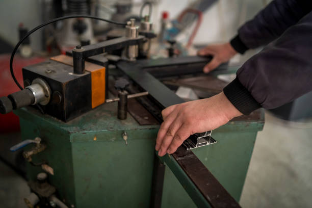 istock Workers In Factory using Aluminum Plates To Create Doors And Windows 1486988560
