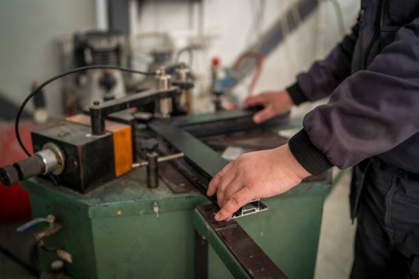 istock Workers In Factory using Aluminum Plates To Create Doors And Windows 1486988588