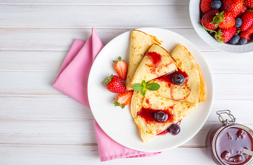 Fruit Pancakes. Strawberry Pancakes, Raspberry, Blueberry, and Chocolate topping