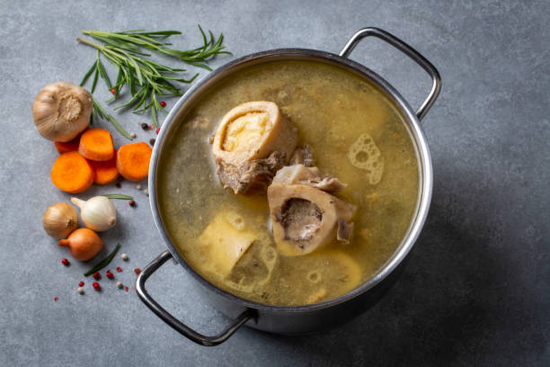 istock Boiled bone and broth. Homemade beef bone broth is cooked in a pot on. Bones contain collagen, which provides the body with amino acids, which are the building blocks of proteins. 1486991857