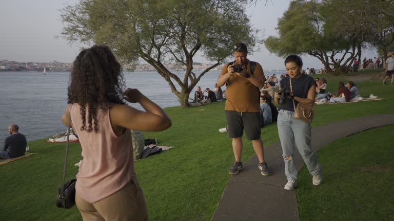 Tourists capturing images in the public park in Almada, Lisbon