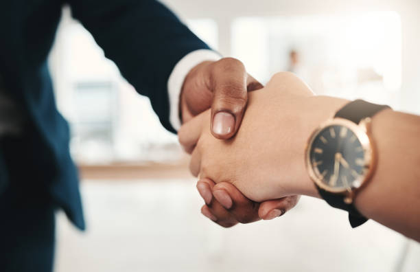 istock Teamwork, handshake and partnership collaboration in office for contract, deal or onboarding. Thank you, welcome or business people shaking hands for hiring, recruitment or agreement, b2b or greeting 1486996444